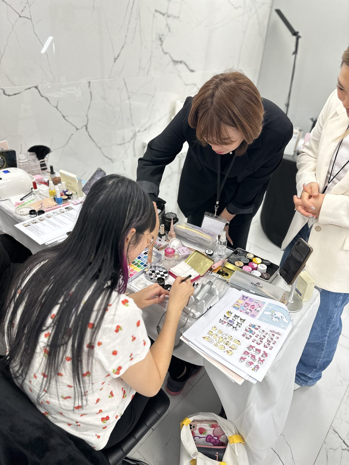 Students practicing Korean nail art techniques during the Make.N seminar
